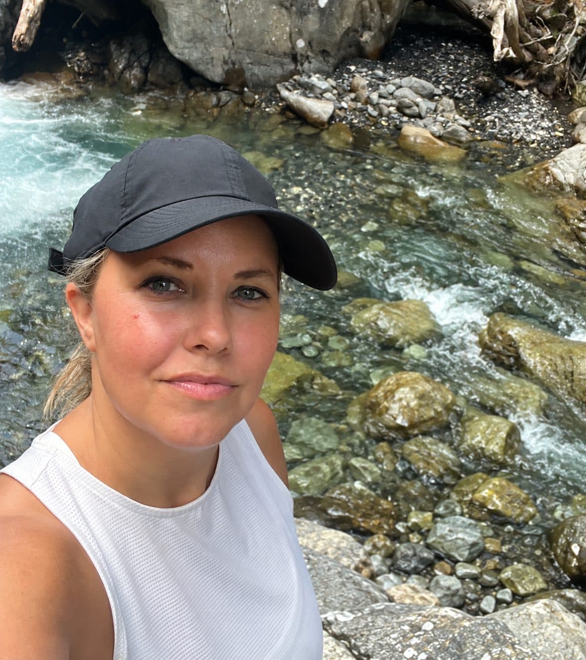 Marie Louise Fabrin outdoors by a mountain river