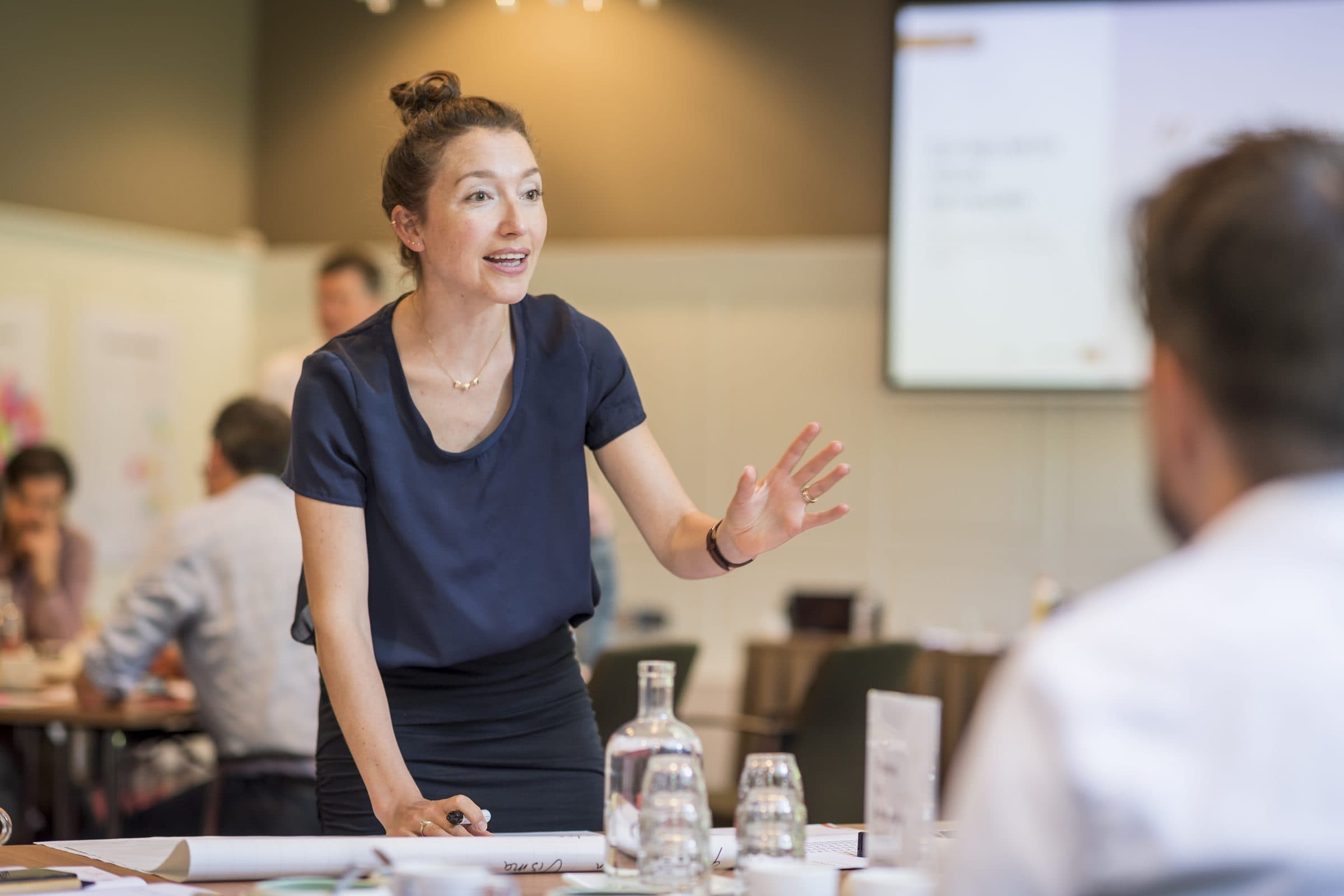 A ScaleUp coach working through a plan with a leadership team